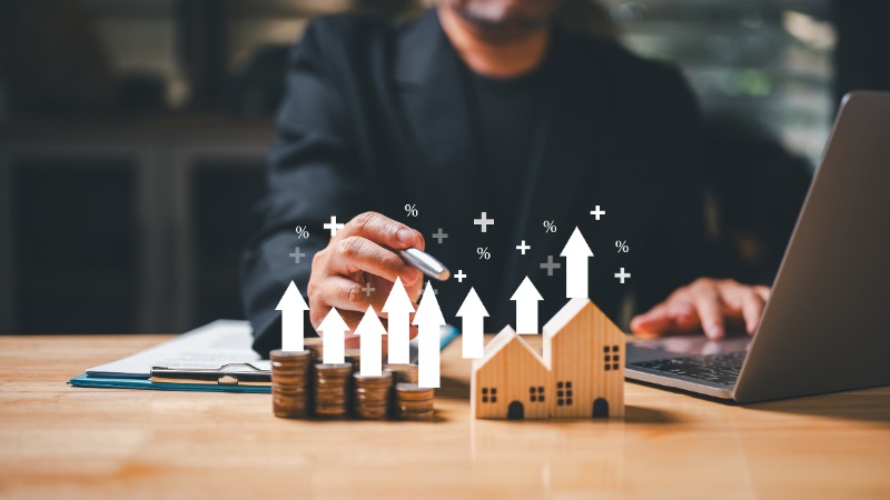 A businessman holding a coin