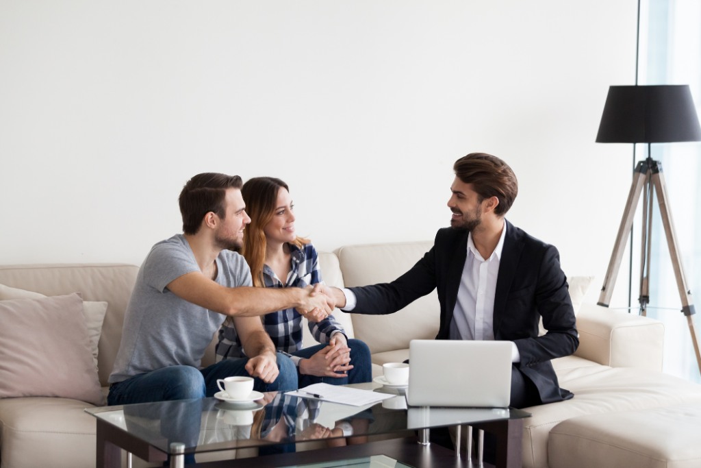 family making deal with Real Estate Agent